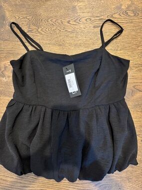 Black bubble hem top. New with tags